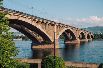 Communal bridge over the Yenisei River at beauty sunny summer day in Krasnoyarsk city.