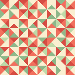 Fototapeta premium Abstract geometric pattern of repeating triangles in warm, retro colors. A seamless tiled design for textiles and digital backgrounds
