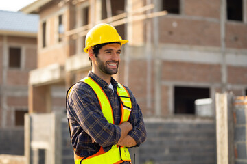 Portrait Hispanic male engineer : Architect, contractor and architecture standing in house building under construction site. Engineering in safety harthat helmet, Professional engineering teamwork