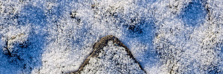 Beautiful winter background with snowy ground. Natural snow texture.