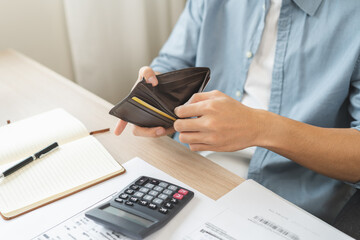 Debt financial concept, stressed problem people asian man, male hand open empty wallet not have budget of money to pay no have credit card, not able payment bill, loan or expense with bank, bankruptcy