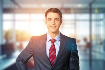 Corporate business man posing in office