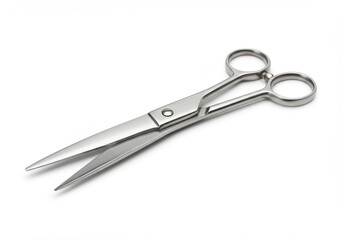 Obraz premium Stainless steel professional shears presented on a plain white background.