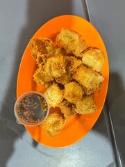 a plate of crispy tofu
