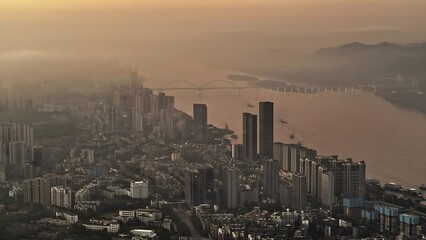 Yichang City Aerial Sunset View Over Yangtze River with Golden Hour Skyline and Mountains, China