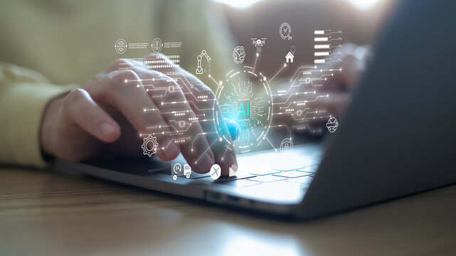 Hands typing on a laptop with a digital interface of AI logistics, smart supply chain, automation, data processing, and technology innovation for transportation and business efficiency.