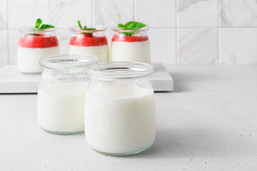 homemade yogurt in jars with strawberries