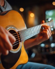 Fototapeta premium Close Up of Hands Playing Acoustic Guitar in Dark Setting