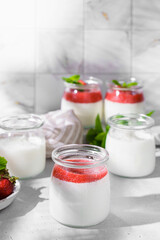 homemade yogurt in jars with strawberries