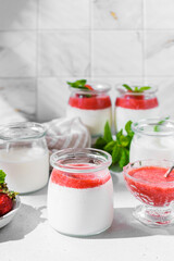 homemade yogurt in jars with strawberries