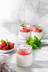 homemade yogurt in jars with strawberries