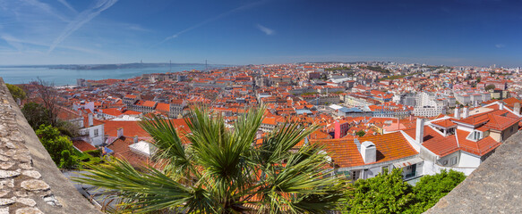 Naklejka premium Terracotta rooftops and garden with river view in Lisbon, Portugal