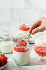 homemade yogurt in jars with strawberries