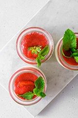 homemade yogurt in jars with strawberries