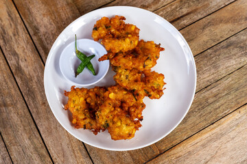 A plate of bakwan jagung or corn fritters Indonesian food