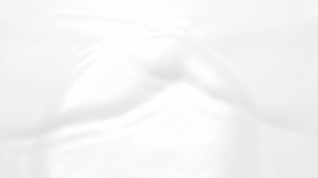 Macro top-down video of pure white high-gloss lacquer liquid with capillary waves