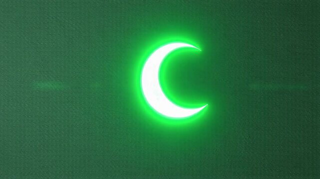 Bright green crescent moon glowing in the dark night sky.