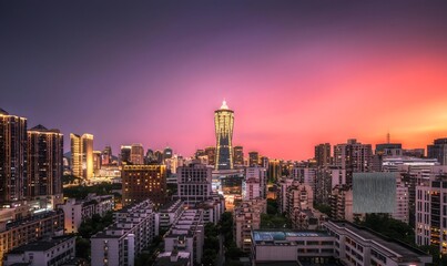 Fototapeta premium Hangzhou City Skyline at Sunset with Vibrant Purple Pink Sky and Modern Skyscrapers China Urban Landscape Architecture