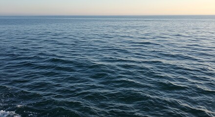 Ocean surface with gentle waves and clear sky
