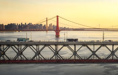 Wuhan China sunset cityscape with steel railway bridge over Yangtze River and urban skyline