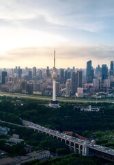 Fototapeta premium Wuhan China City Skyline at Sunset with TV Tower and Yangtze River Bridge Aerial View