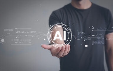 Person holding a glowing AI symbol, representing the future of artificial intelligence and technology.