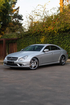 Mercedes-Benz CLS 63 AMG in golden hour light, Elegant German performance sedan

