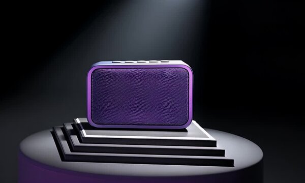 Dynamic Spotlight Reveal of a Modern Purple Bluetooth Speaker on a Sleek Pedestal