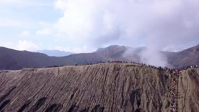 Tourists on the Caldera of an Active Volcano. Aerial View