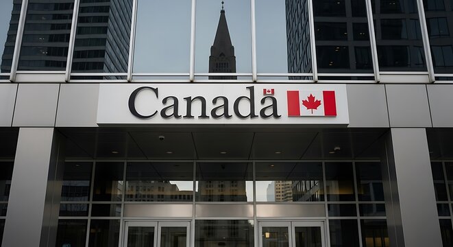 Exterior shot of the canadian government building featuring the canada sign with the maple leaf flag, reflecting a skyscraper in its glass facade