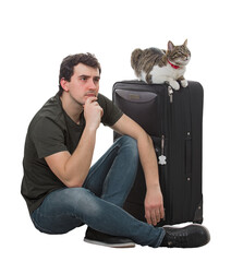 Pensive man seated with his cat companion near the travel luggage. Full length thoughtful male...