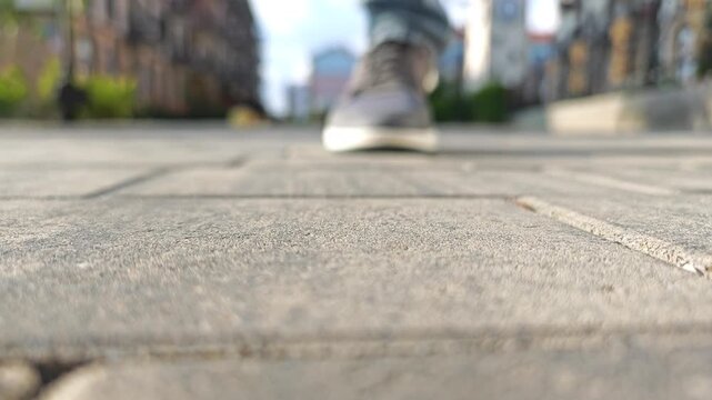 Man Finding Coin on Street