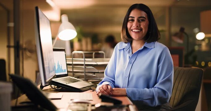 Woman, face and happy at night, office and computer with charts, pride and confident with accounting. Person, smile and accountant with review, portrait or dark workplace at finance agency in Mexico