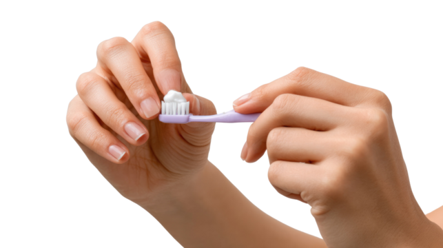 Gentle Care Ritual: A close-up shot reveals hands meticulously applying toothpaste onto a toothbrush, emphasizing the care involved in maintaining healthy dental hygiene. 