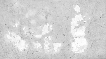 Old grunge wall background with cracked and peeling white paint. Old cement wall surface texture....