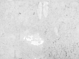 Old grunge wall background with cracked and peeling white paint. Old cement wall surface texture....