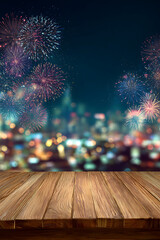 Wooden table foreground with vibrant fireworks illuminating a city skyline at night