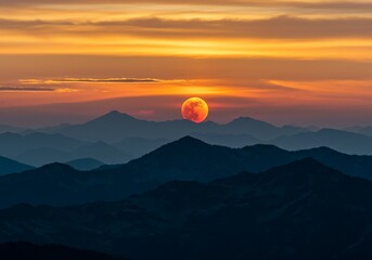 Fototapeta premium Blood Moon Rising Over Mountain Peaks at Sunset with Golden Sky
