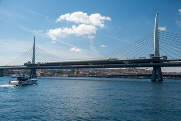 The various architectural views and perspectives of the Golden Horn Metro Bridge, located in the touristy Eminönü Golden Horn district of Istanbul, its cable-supported design and engineering structure