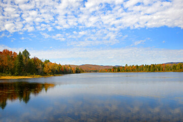 Fototapeta premium Clouds Reflect on Surface of Pontook Reservoir