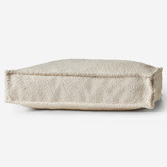 Comfortable square floor cushion resting on white background