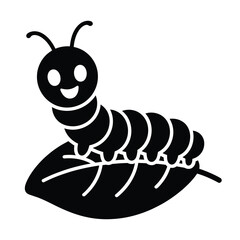 Happy black and white caterpillar sitting on a green leaf