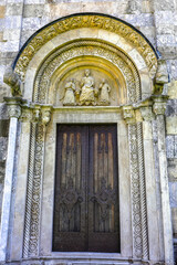 Fototapeta premium Visoki Decani Serbian orthodox monastery church door and tympanum, Kosovo