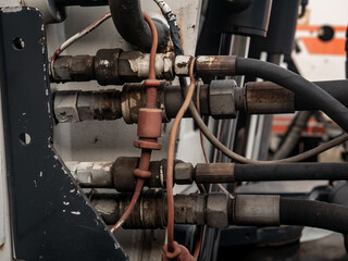 hydraulic hoses and connectors on heavy machinery