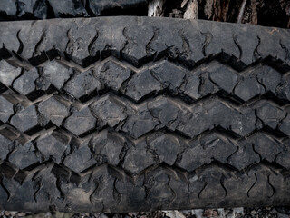 a worn tire with raw tread detail and texture