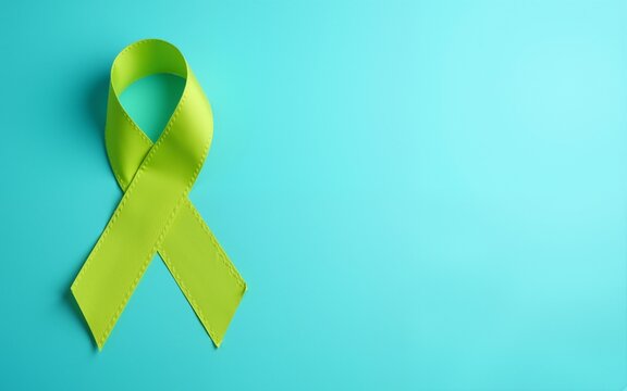 September World lymphoma and October Mental health day Awareness month, lime green Ribbon color on blue background for supporting people living, and illness. Healthcare concepts. High quality - Powered by Adobe