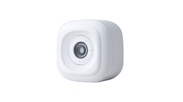 Compact, square, white device with circular lens