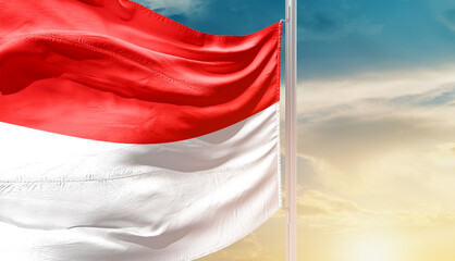 Indonesia national flag waving in an amazing sunlight. National flag wavering on mast.