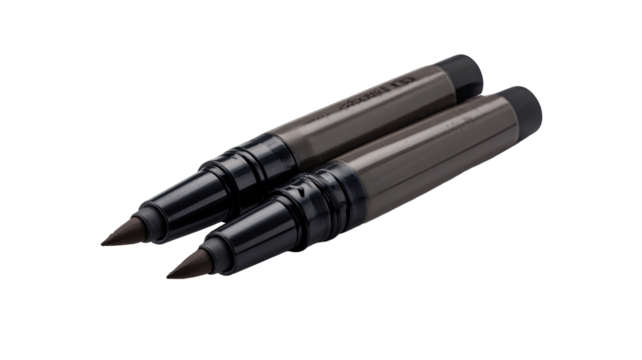 Two dark gray cosmetic markers, angled, close-up.  Dual-tipped,  black and gray