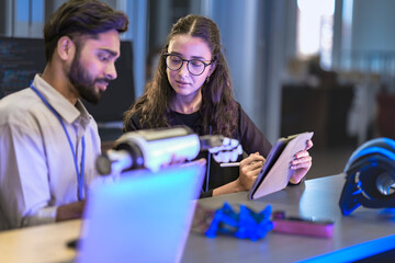 Bio-mechanical engineers test a myoelectric prosthetic arm on a user. They are calibrating the sensors and actuators for optimal neuromuscular control and functionality in an R&D lab.